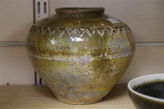 A Chinese green glazed jar, two other pottery jars and a pottery figure